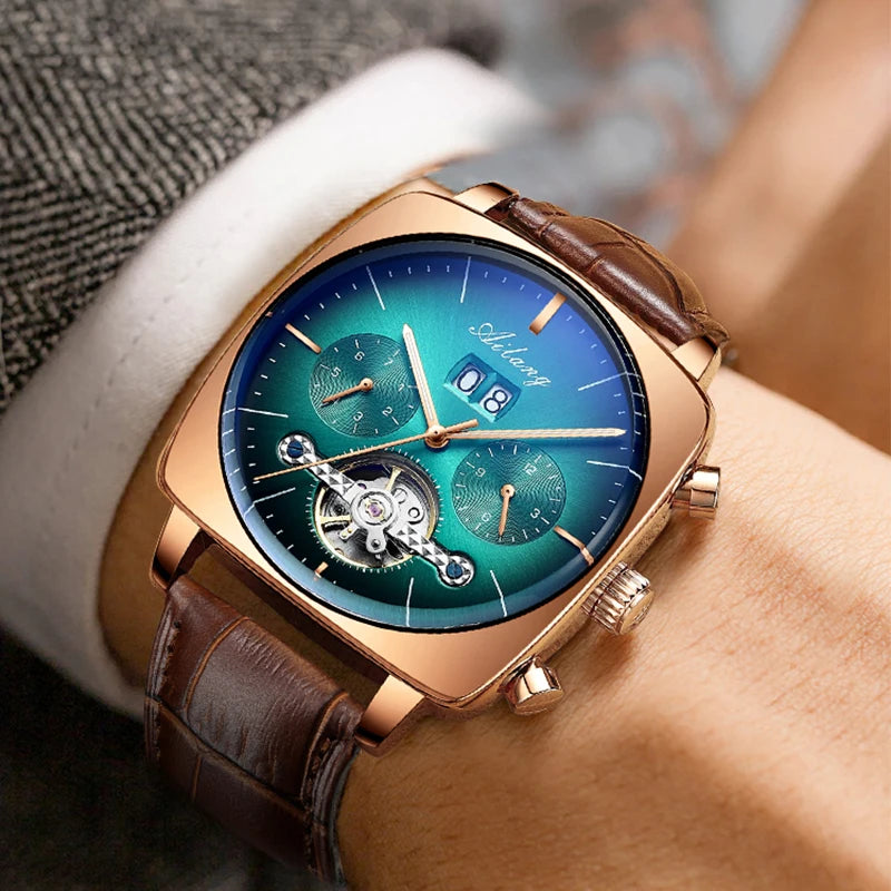 A man's chronograph watch on a wrist with green dial, rose gold casing and brown leather strap.