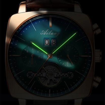 Close up view of a man's chronograph watch with rose gold casing in the dark with hands illuminated.