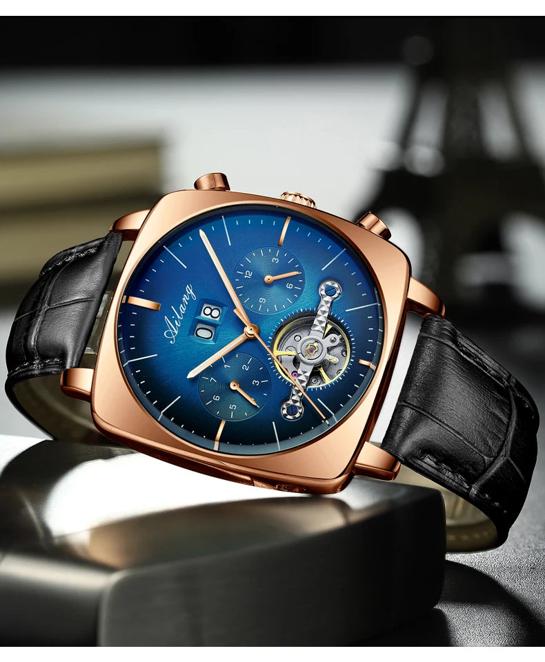 A man's chronograph watch featuring a blue dial, rose gold casing, and a black leather strap.