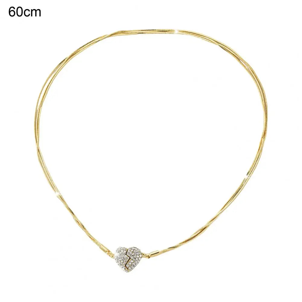 A 60cm gold chain with gold broken heart rhinestone pendant.