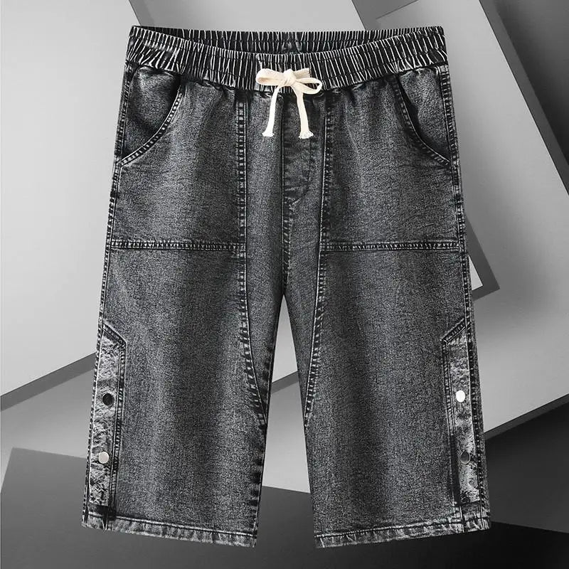 A pair of gray men's over the knee length baggy denim jeans shorts.